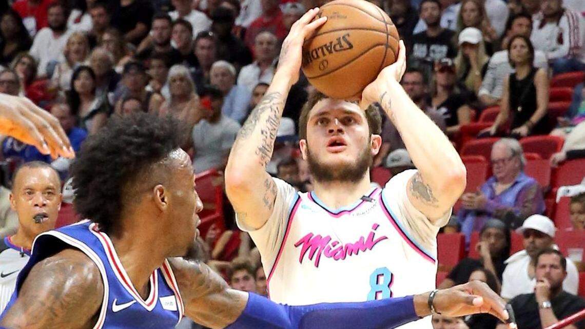 Miami Heat Tyler Johnson looks to shoot over Philadelphia 76ers Robert Covington in the second quarter at the AmericanAirlines Arena in Miami, Florida, February 27, 2018.