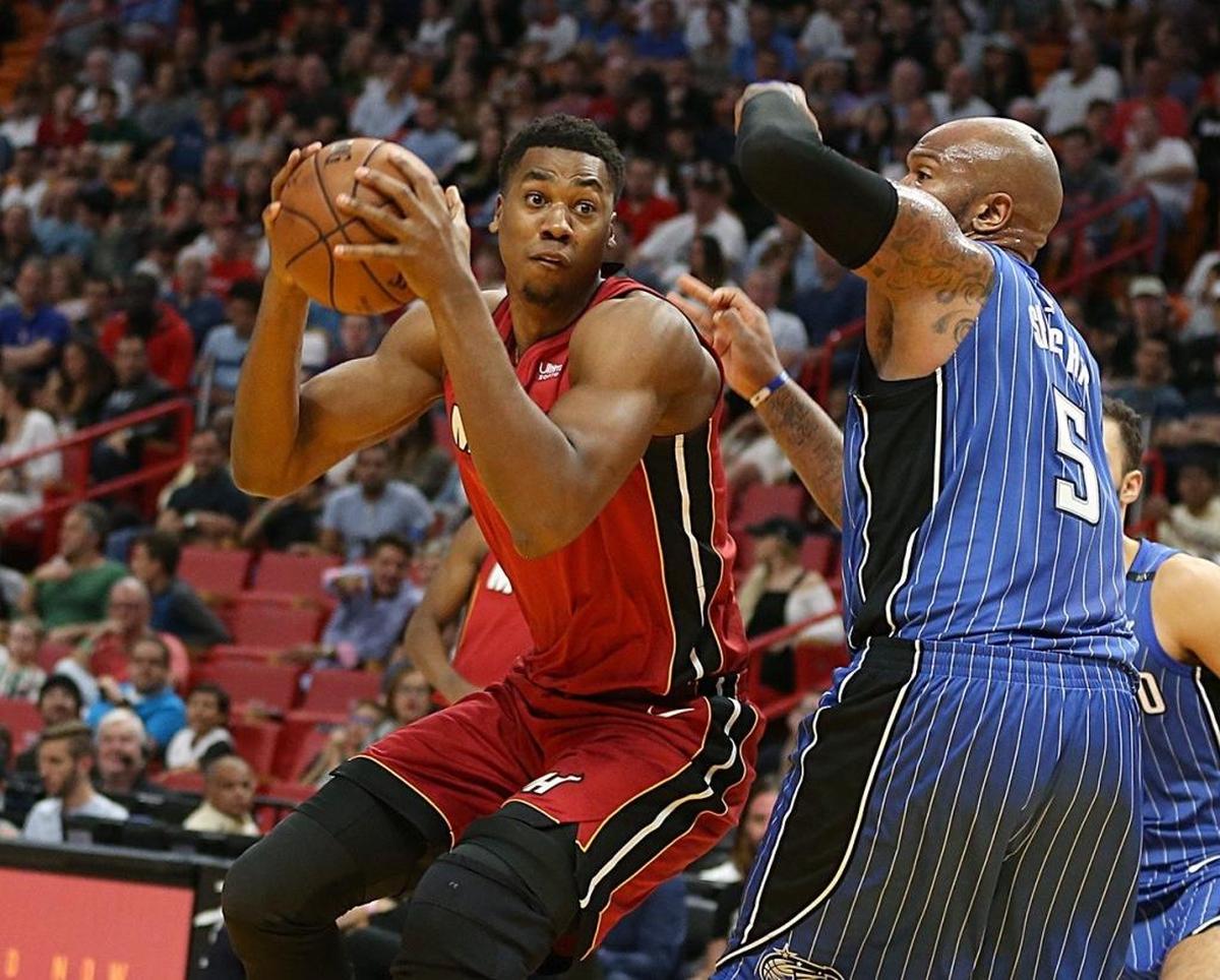 Miami Heat center Hassan Whiteside goes to the basket against Orlando Magic forward Marreese Speights in the second quarter of a game at AmericanAirlines Arena in Miami on Tuesday, December 26, 2017.
