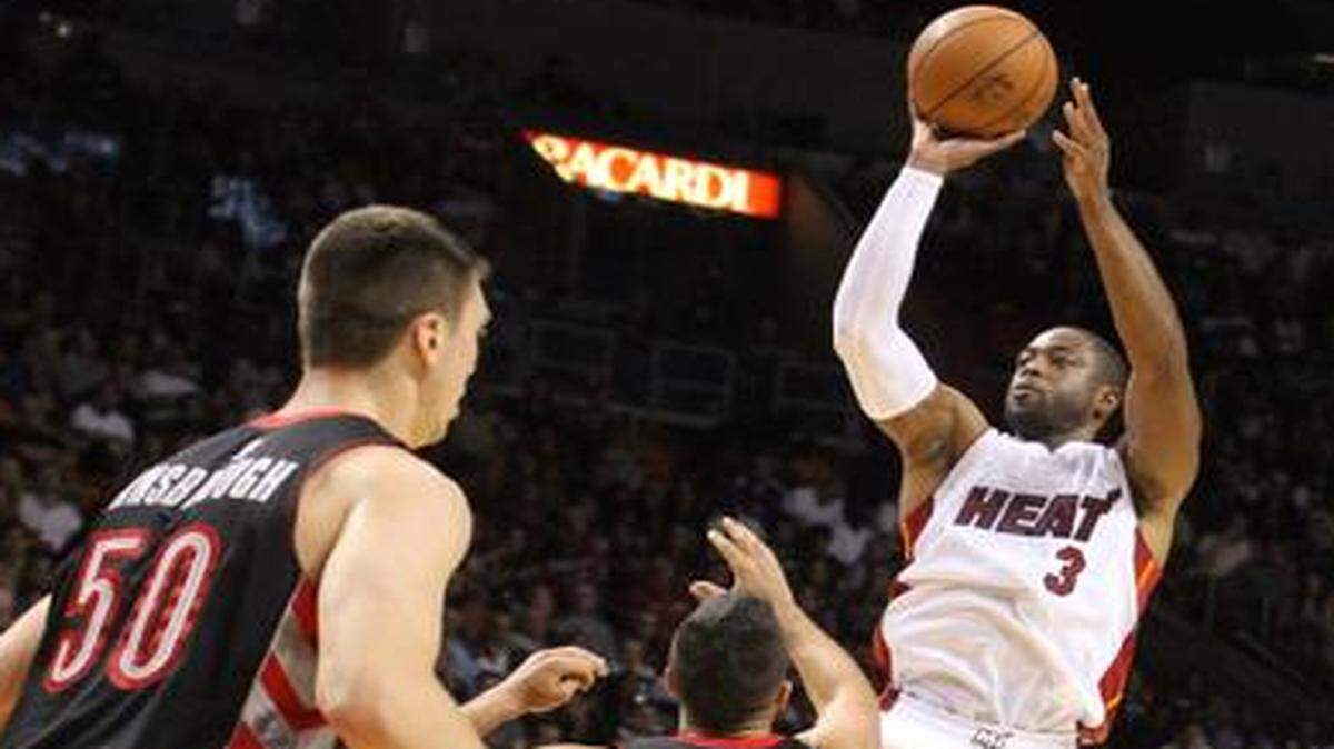 
Miami Heat’s Dwyane Wade shoots a three pointer in the third quarter against the Toronto Raptors at the AmericanAirlines Arena on Sunday, Nov. 2, 2014.
