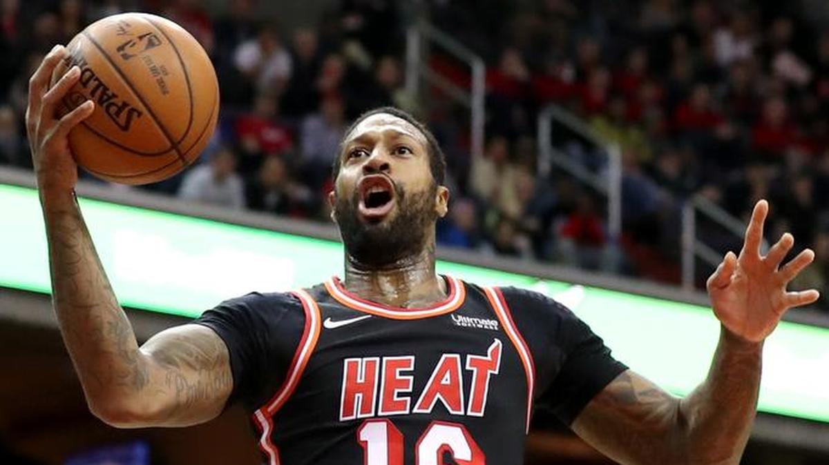 James Johnson of the Miami Heat puts up a shot in front of Bradley Beal of the Washington Wizards in the first half at Capital One Arena on November 17, 2017 in Washington, DC.