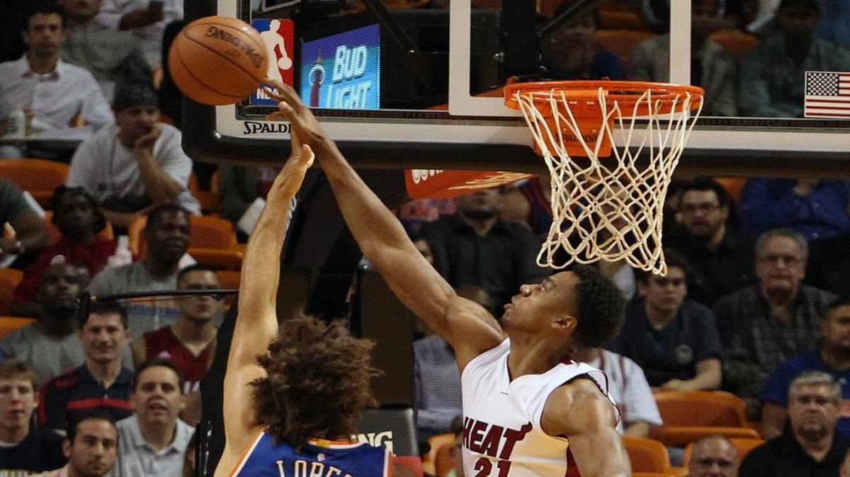 Miami Heat's Hassan Whiteside blocks the shot of New York Knicks' Robin Lopez during the first quarter on Monday, Nov. 23, 2015, at AmericanAirlines Arena in Miami.