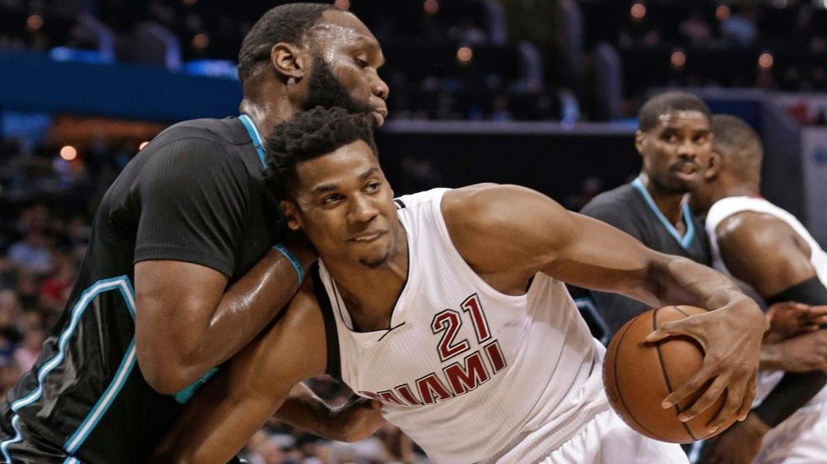 Miami Heat's Hassan Whiteside, right, drives against Charlotte Hornets' Al Jefferson, left, during the first half of an NBA first-round playoff basketball game in Charlotte, N.C., Saturday, April 23, 2016.
