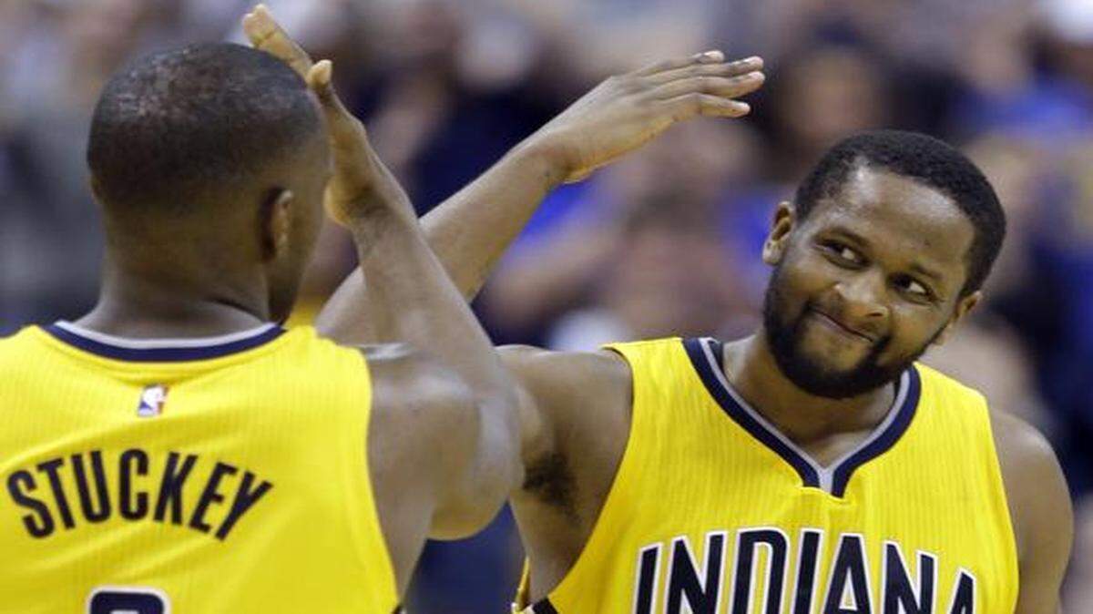 
Indiana Pacers guard C.J. Miles (0) celebrates with guard Rodney Stuckey (2) during the second overtime period of an NBA basketball game against the Washington Wizards in Indianapolis on April 14, 2015. The Pacers defeated the Wizards 99-95 in double overtime.
