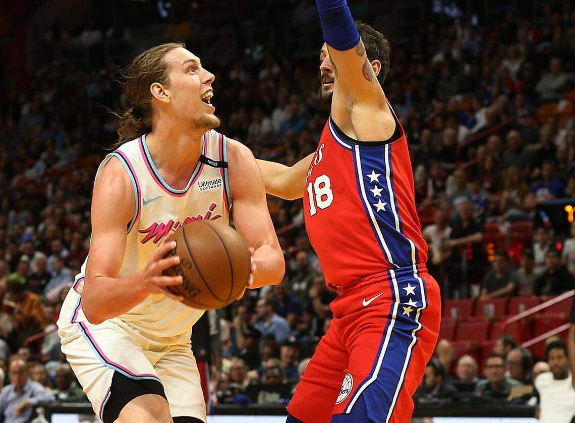 Heat forward Kelly Olynik goes to the basket against Philadelphia's guard Marco Belinelli, in the second quarter of the Miami Heat vs Philadelphia 76ERS, game at AmericanAirlines Arena in Miami on Thursday, March 08, 2018.
