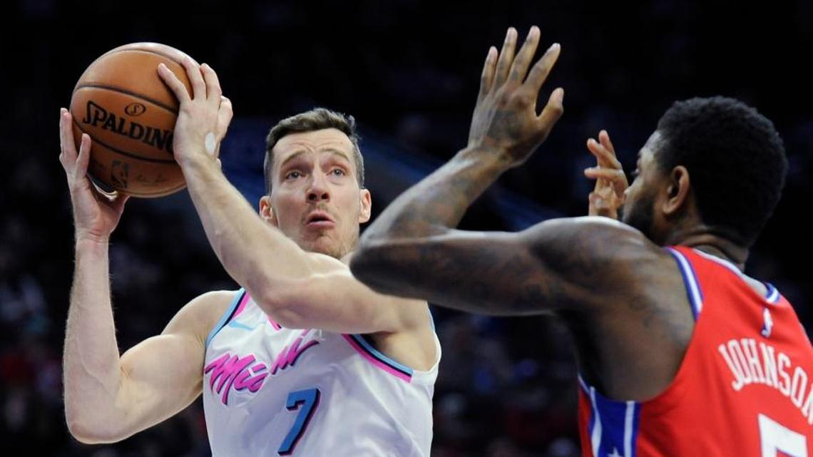 Miami Heat's Goran Dragic (7) looks for room to shoot around Philadelphia 76ers' Amir Johnson (5) in the first half of an NBA basketball game, Wednesday, Feb. 14, 2018, in Philadelphia.