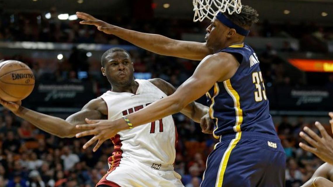 Miami Heat guard Dion Waiters (11) passes under the basket against Indiana Pacers center Myles Turner (33) in the second half of an NBA basketball game, Saturday, Feb. 25, 2017, in Miami. The Heat won 113-95.