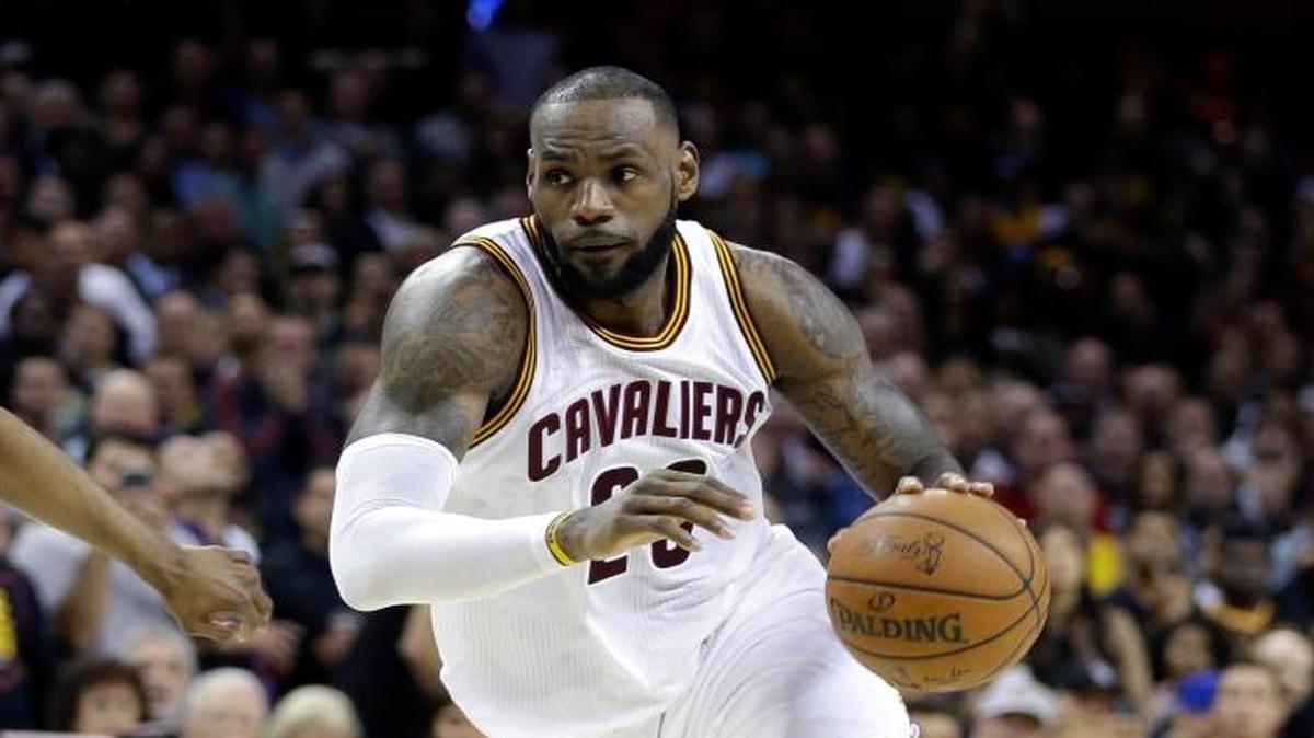 Cleveland forward LeBron James drives past Golden State Warriors guard Ian Clark during the second half of Game 3 of the NBA Finals in Cleveland on Wednesday.