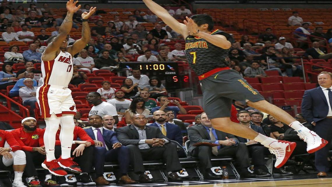Miami Heat guard Rodney McGruder hits a three pointer against Atlanta Hawks forward Ersan Ilyasova during the first quarter of an NBA preseason game at the AmericanAirlines Arena in Miami on Sunday, Oct. 1, 2017.