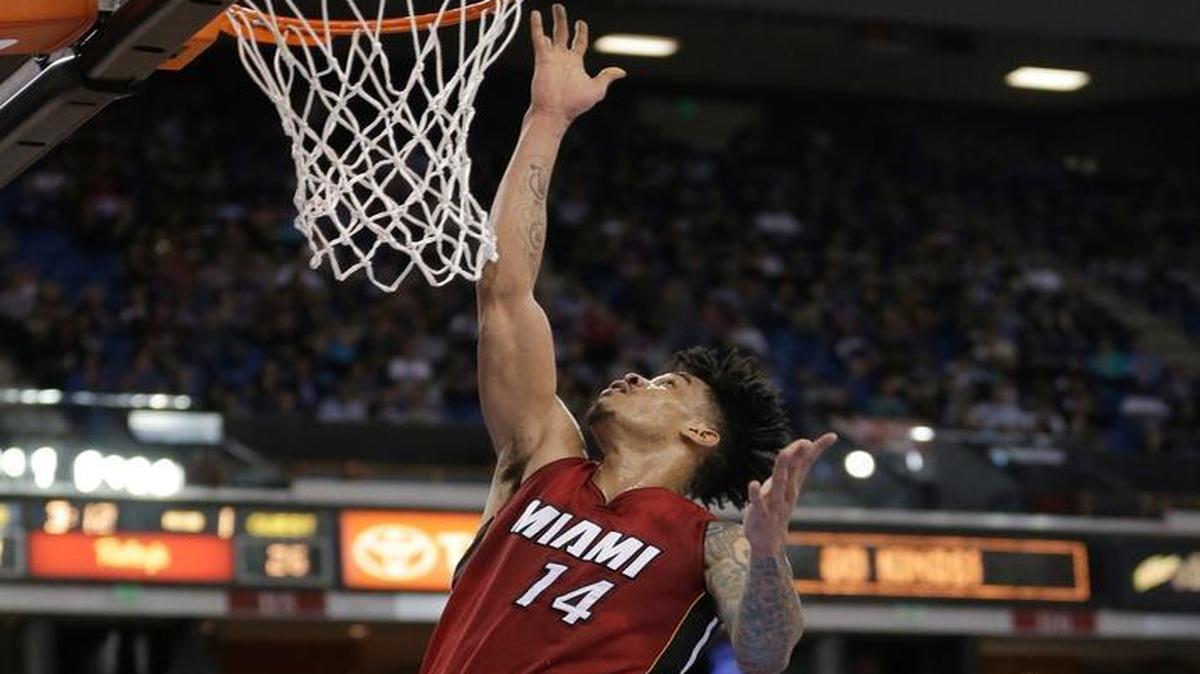 Miami Heat forward Gerald Green, left, goes to the basket as Sacramento Kings center Kosta Koufos, right, looks on during the first quarter of an NBA basketball game Friday, April 1, 2016, in Sacramento, Calif.