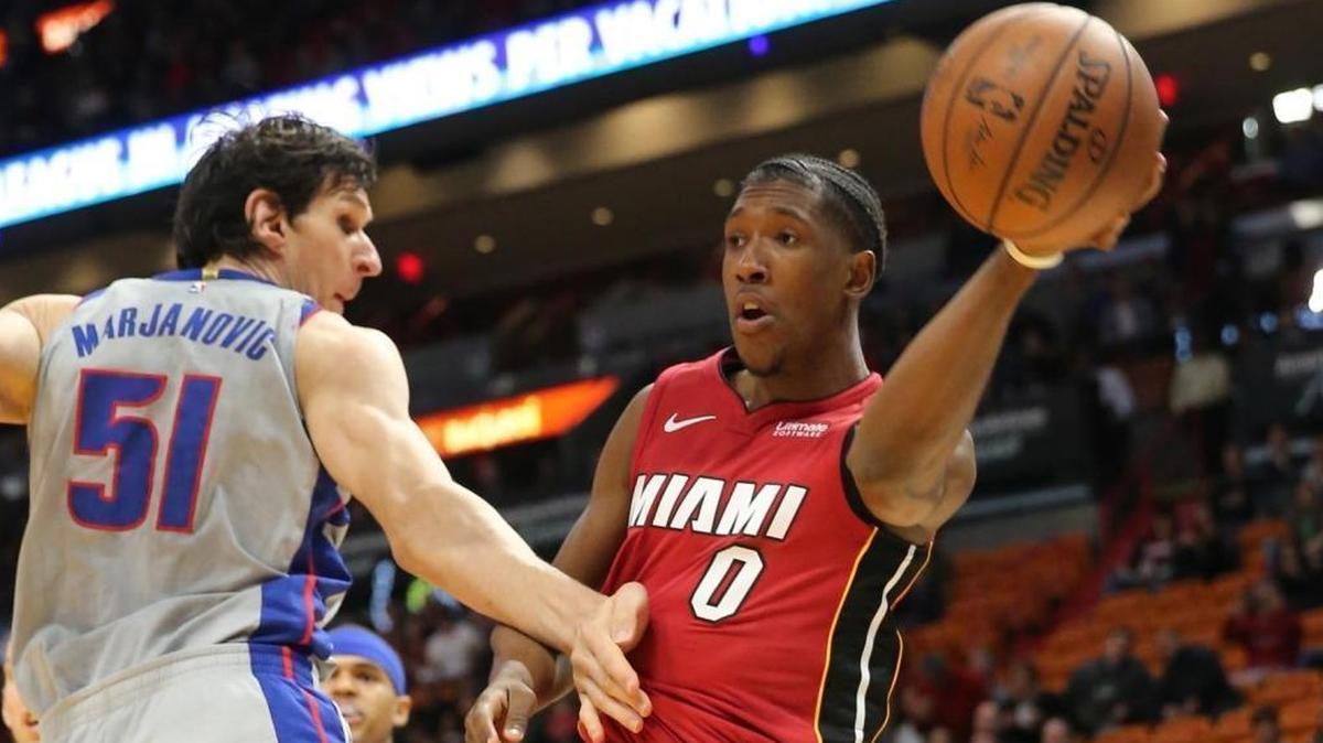 The Miami Heat’s Josh Richardson (0) throws the ball around the Detroit Pistons’ Boban Marjanovic (51) in the first quarter at the AmericanAirlines Arena in Miami, on Jan. 3, 2018.