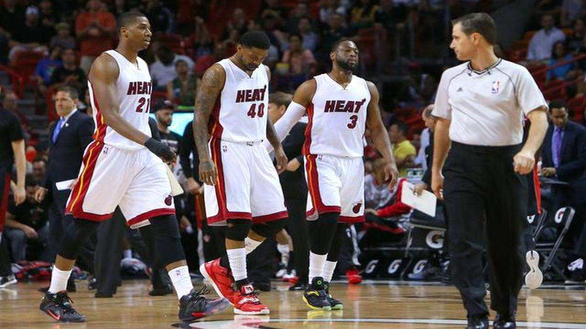 
Miami Heat center Hassan Whiteside,left, Udonis Haslem, and Dwyane Wade during the first quarter of an NBA basketball game against the Toronto Raptors at the AmericanAirlines Arena in Miami on Saturday, April 11, 2015.
