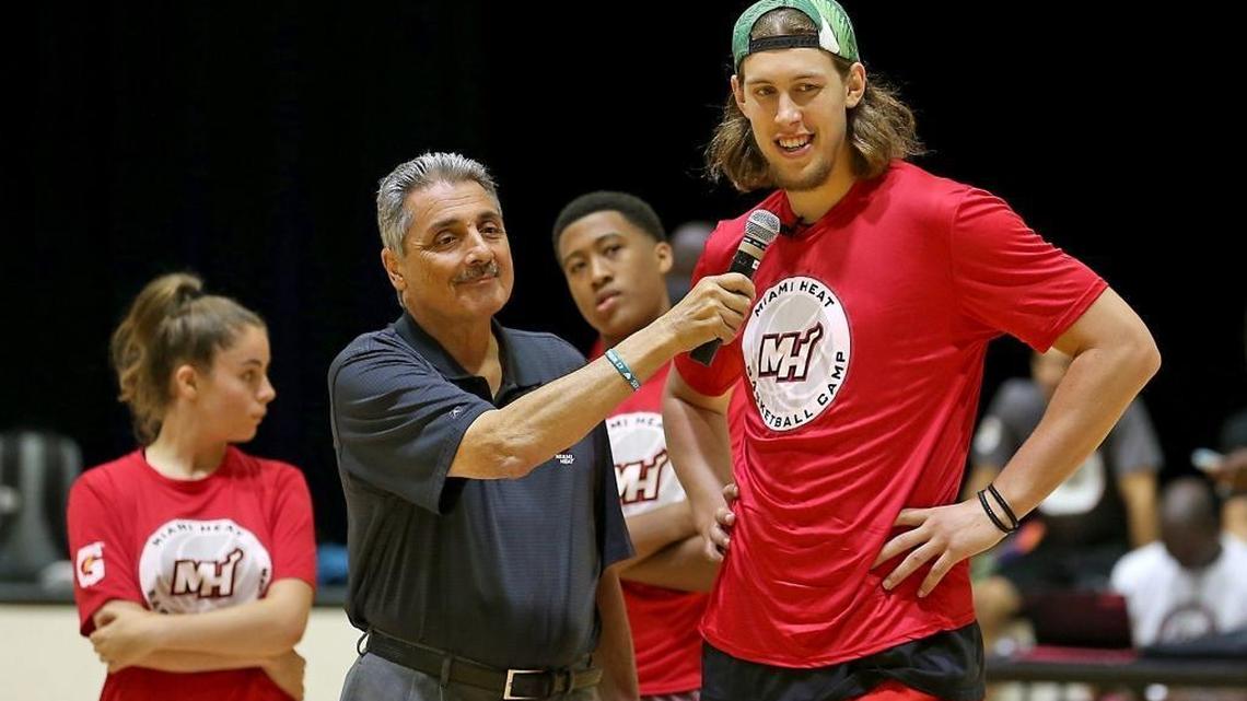 Heat forward Kelly Olynyk chats with Tony Fiorentino, television color commentator for the Miami Heat, as he visits the Miami Heat basketball camp at Miami Dade College's Kendall campus on Wednesday, August 9, 2017.