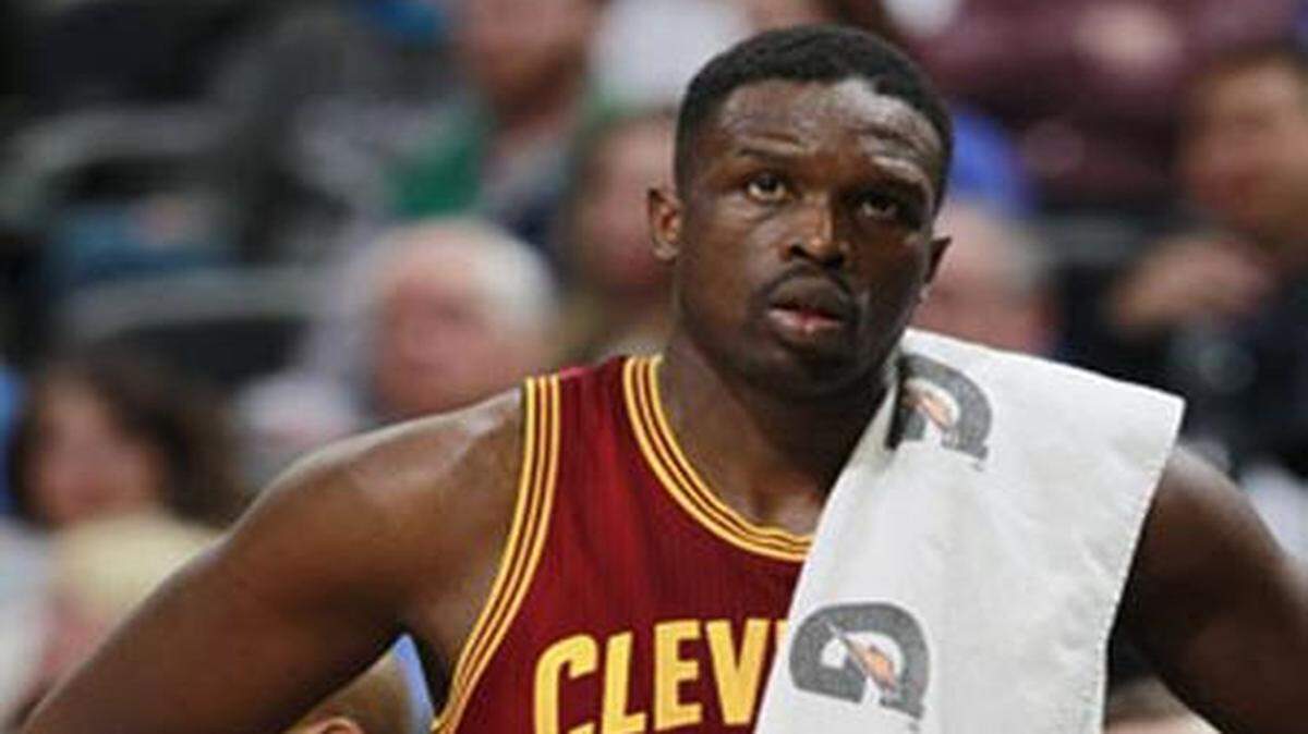 
FILE - In this Jan. 17, 2014, file photo, then-Cleveland Cavaliers forward Luol Deng looks on against the Denver Nuggets in the fourth quarter of the Cavaliers' 117-109 victory in an NBA basketball game in Denver. Atlanta Hawks general manager Danny Ferry has been disciplined by CEO Steve Koonin for making racially charged comments about Luol Deng when the team pursued the free agent this year. Ferry apologized Tuesday, Sept. 9, 2014, for “repeating comments that were gathered from numerous sources” about Deng.

