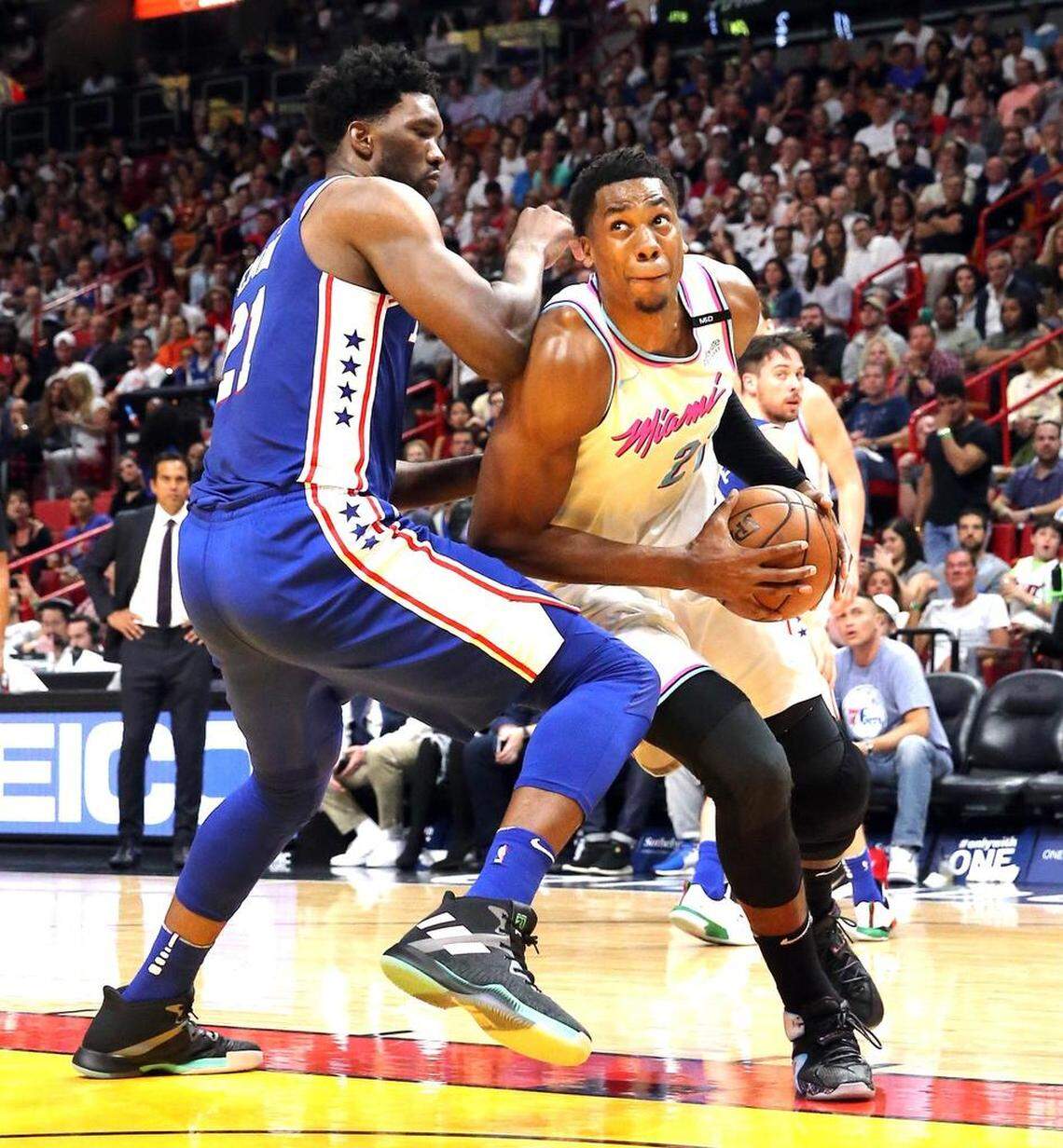 Miami Heat Hassan Whiteside looks to the basket as Philadelphia 76ers Joel Embiid defends in the second quarter at the AmericanAirlines Arena in Miami, Florida, February 27, 2018.