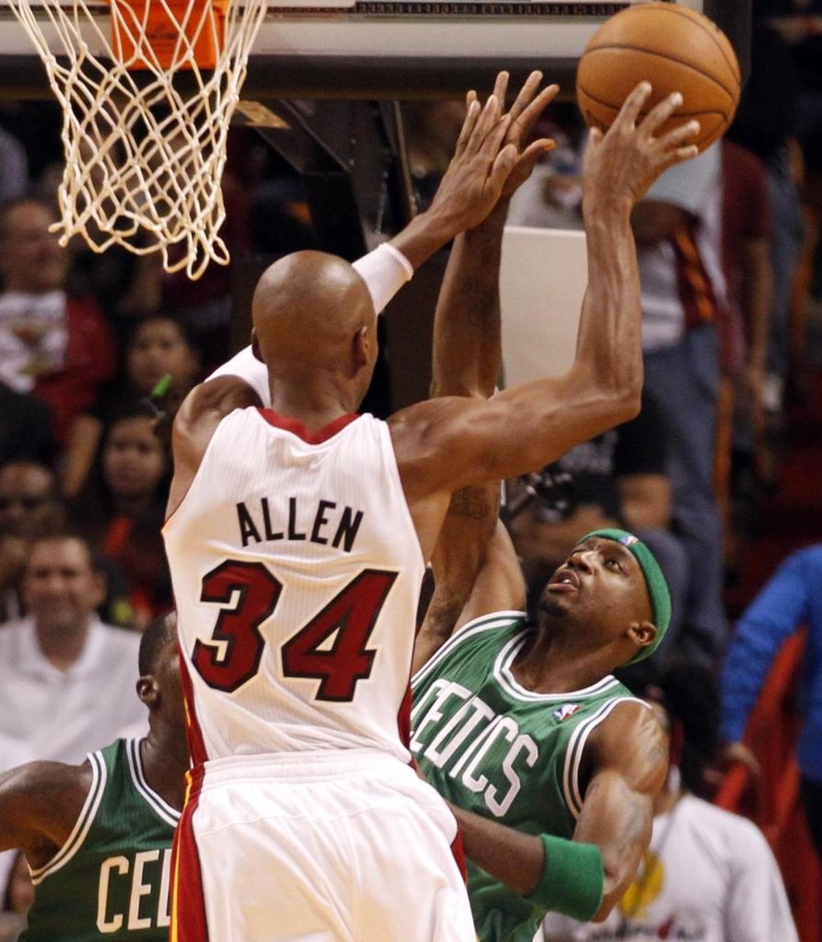 Miami Heat's Ray Allen shoots over Boston Celtics' Jason Terry in the third quarter at the AmericanAirlines Arena in Miami, Florida, Oct. 20, 2012.