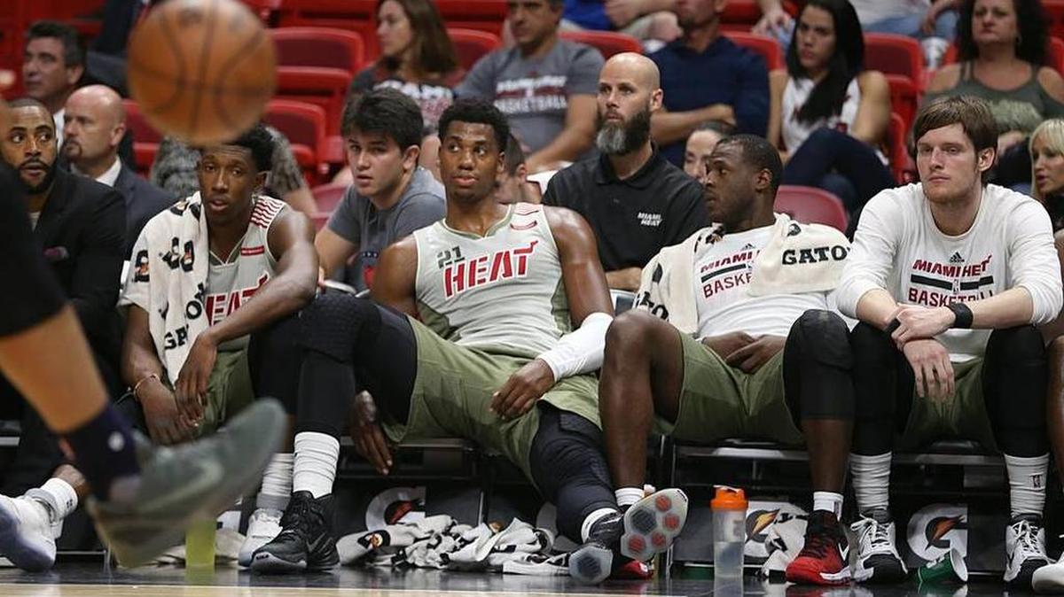 From left: Miami Heat Josh Richardson; Hassan Whiteside; Dion Waiters; and Luke Babbitt sit on the bench at the end of the fourth quarter of the Miami Heat vs Utah Jazz NBA game at AmericanAirlines Arena in Miami on Saturday, Nov. 12, 2016.