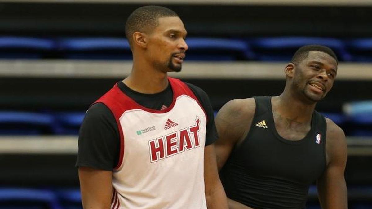 Chris Bosh, left, and James Ennis of the Miami Heat are shown during a training camp practice at FAU Arena on Thursday, Oct. 1, 2015.
