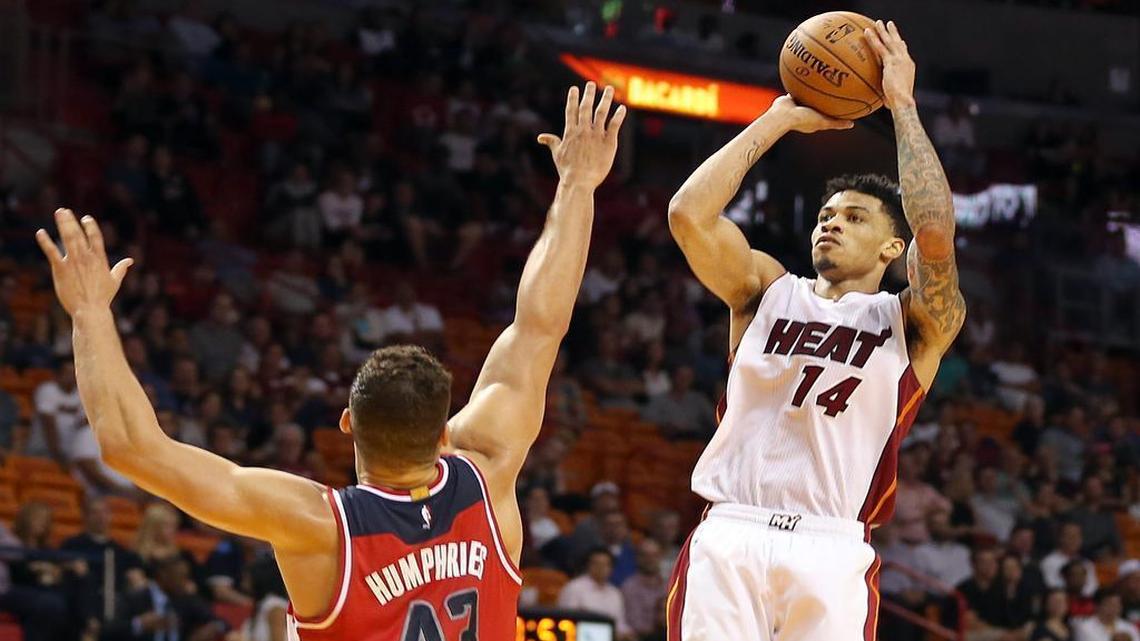 Gerald Green takes a shot over Kris Humphries in the fourth quarter of the Miami Heat’s preseason game against the Washington Wizards at AmericanAirlines Arena in Miami on Wednesday, October 21, 2015.