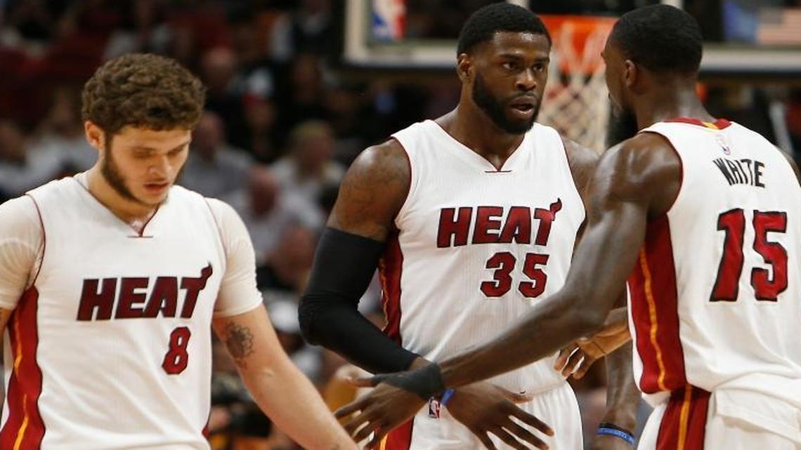 Miami Heat forward Willie Reed (35) is congratulated by Okaro White (15) during the second quarter of an NBA basketball game against the Washington Wizards at AmericanAirlines Arena in Miami on Wednesday, March 12, 2017.