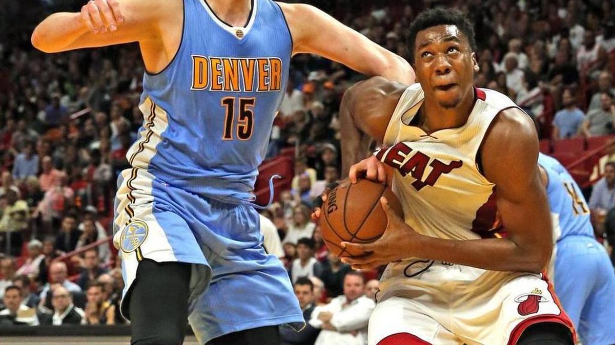 Miami Heat center Hassan Whiteside drives toward the basket as Denver Nuggets center Nikola Jokic defends him in the second quarter at the AmericanAirlines Arena, Miami, Florida, April 2, 2017.