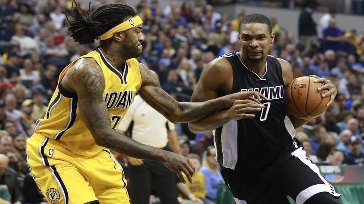 Miami Heat forward Chris Bosh, right, drives around Indiana Pacers center Jordan Hill in the first half Friday, Dec. 11, 2015, in Indianapolis.