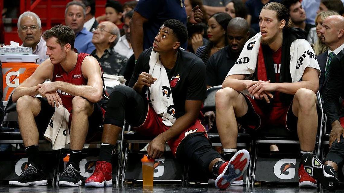 Miami Heat guard Goran Dragic, center Hassan Whiteside and forward Kelly Olynyk sit on the bench in the fourth quarter of the Heat’s 107-89 win over the Orlando Magic at AmericanAirlines Arena in Miami on Tuesday, Dec. 26, 2017.