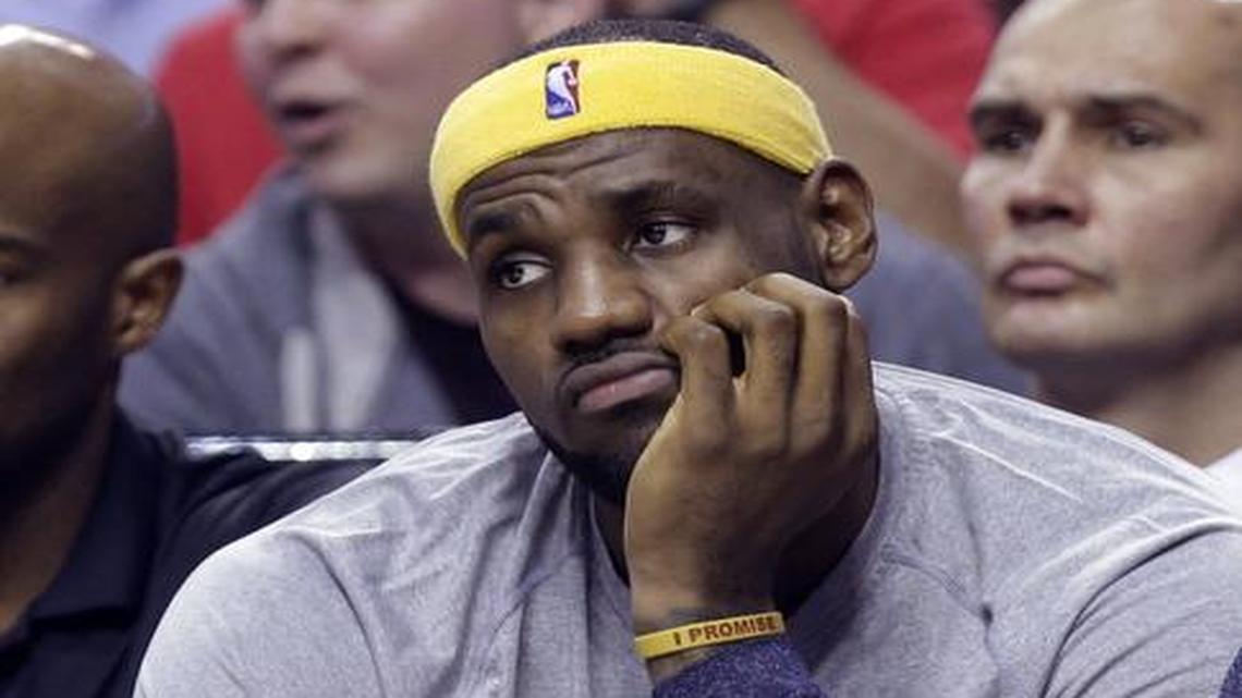 
 LeBron James watches Tuesday night as the Cavaliers get blown out at Portland to fall to 1-2.
