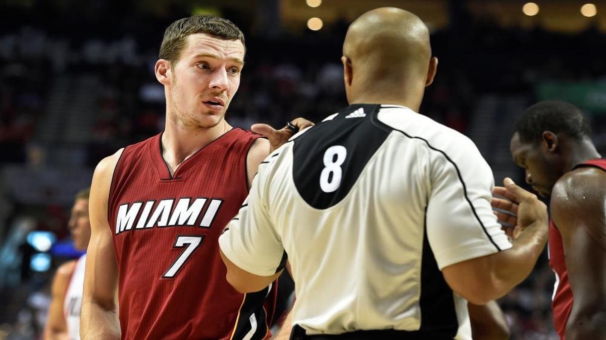 Miami Heat guard Goran Dragic (7) talks with referee Marc Davis (8) during the first quarter of an NBA basketball game against the Portland Trail Blazers in Portland, Ore., Saturday April 2, 2016.