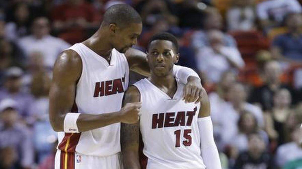 <cutline_leadin>Bigger role:</cutline_leadin> Heat center Chris Bosh, left, talks to guard Mario Chalmers during a preseason game. Bosh said — as the Heat’s current franchise player — he talks to his teammates all the time.