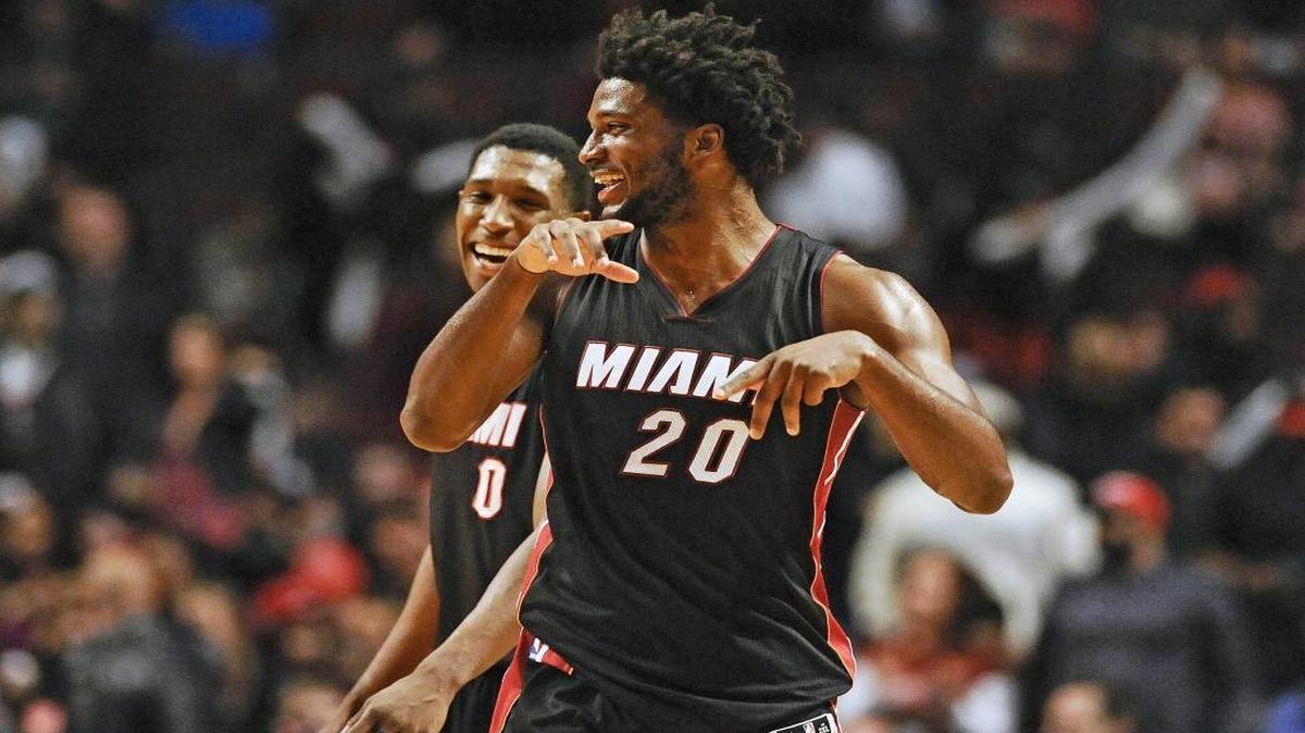Miami Heat guard Josh Richardson (0) and Miami Heat forward Justise Winslow, right, celebrate at the end of a game Friday, March 11, 2016, in Chicago. The Miami Heat beat the Chicago Bulls 118-96.