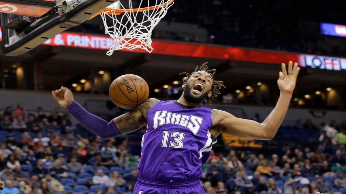 Sacramento Kings forward Derrick Williams (13) reacts after dunking against the Minnesota Timberwolves during the second quarter of an NBA basketball game in Minneapolis, Thursday, Jan. 1, 2015.