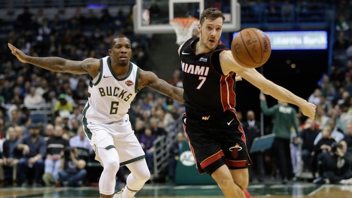 Miami Heat's Goran Dragic and Milwaukee Bucks' Eric Bledsoe go after a loose ball during the first half of an NBA basketball game Wednesday, Jan. 17, 2018, in Milwaukee.
