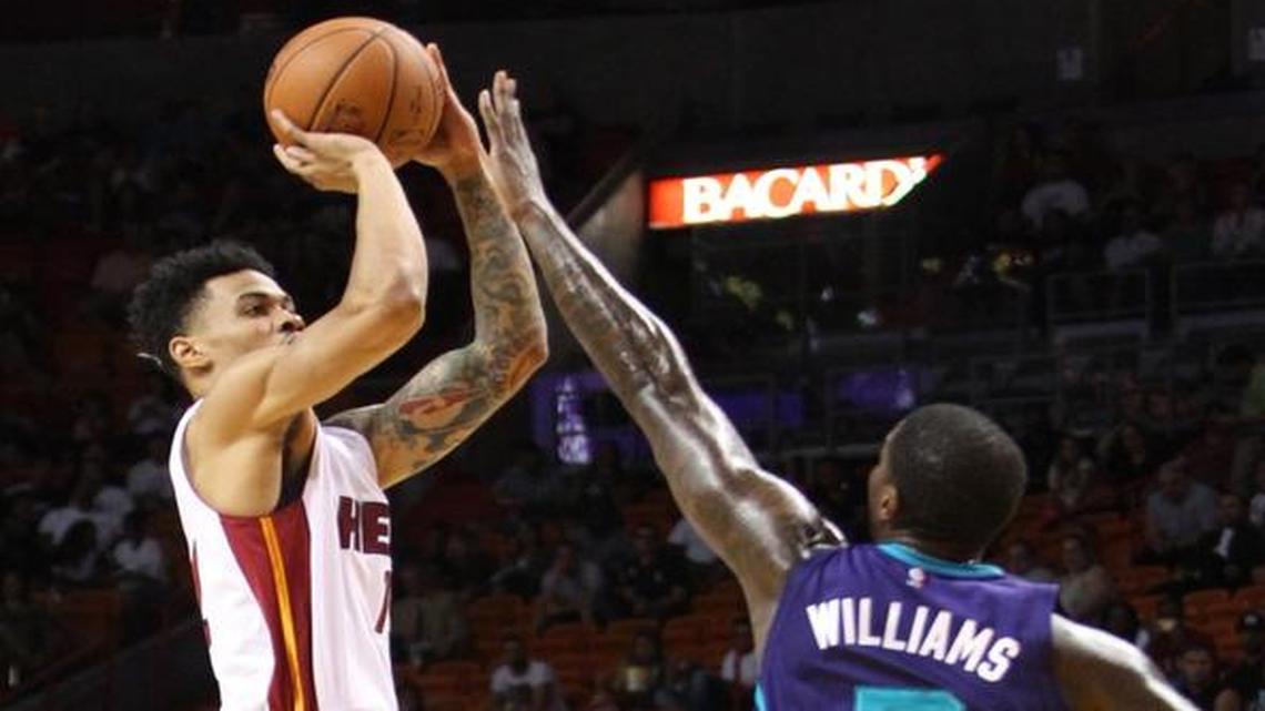
Gerald Green takes a shot over Marvin Williams in the second quarter of the preseason game between the Miami Heat and the Charlotte Hornets on Sunday, October 4, 2015 at AmericanAirlines Arena in Miami.
