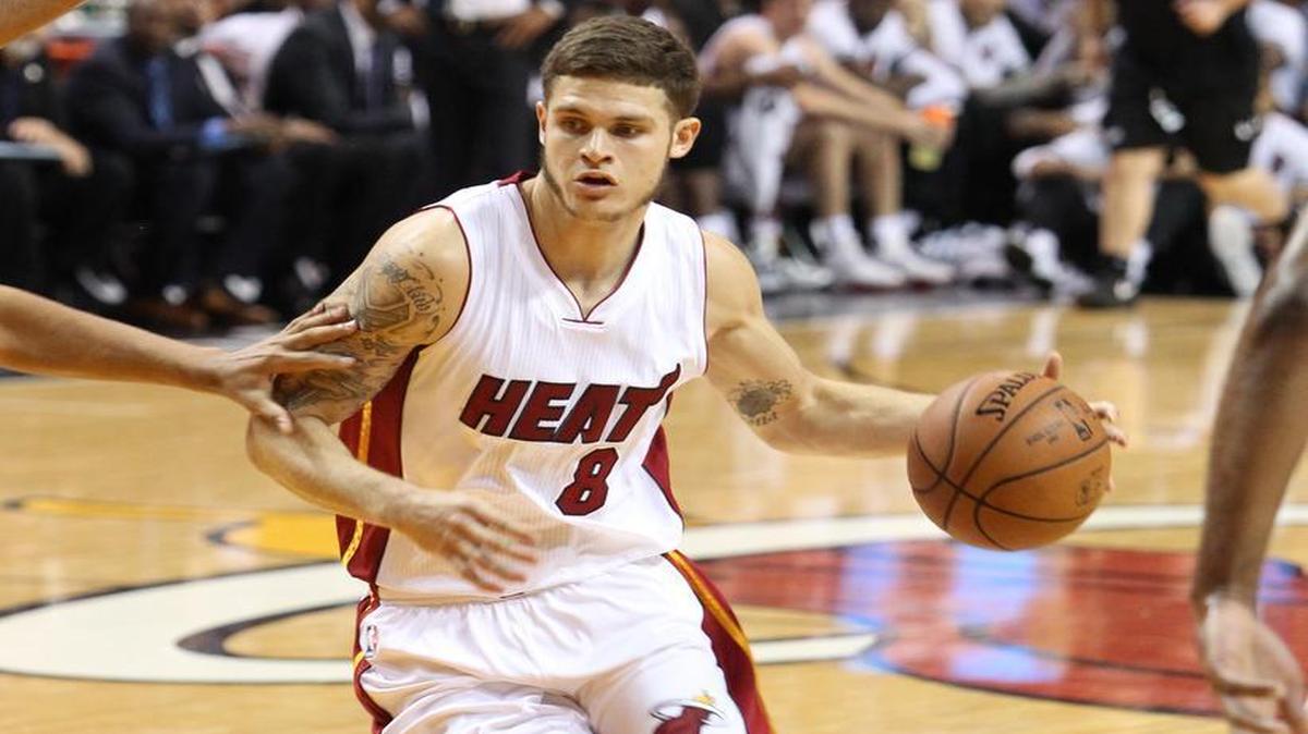 
Tyler Johnson of the Miami Heat drives to the basket in the first quarter of a preseason game against the San Antonio Spurs on Monday, October 12, 2015 at the AmericanAirlines Arena in Miami.
