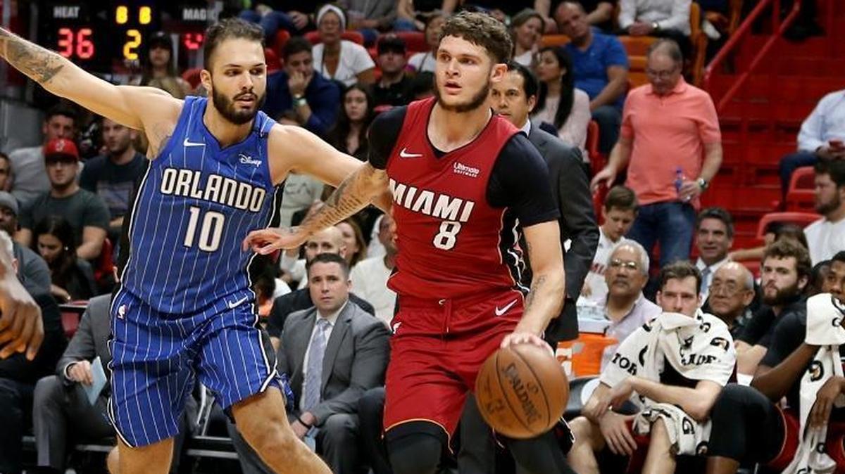 Miami Heat guard Tyler Johnson drives to the basket against Magic guard Evan Fournier in the second quarter of a Heat win at AmericanAirlines Arena in Miami on Tuesday, December 26, 2017.