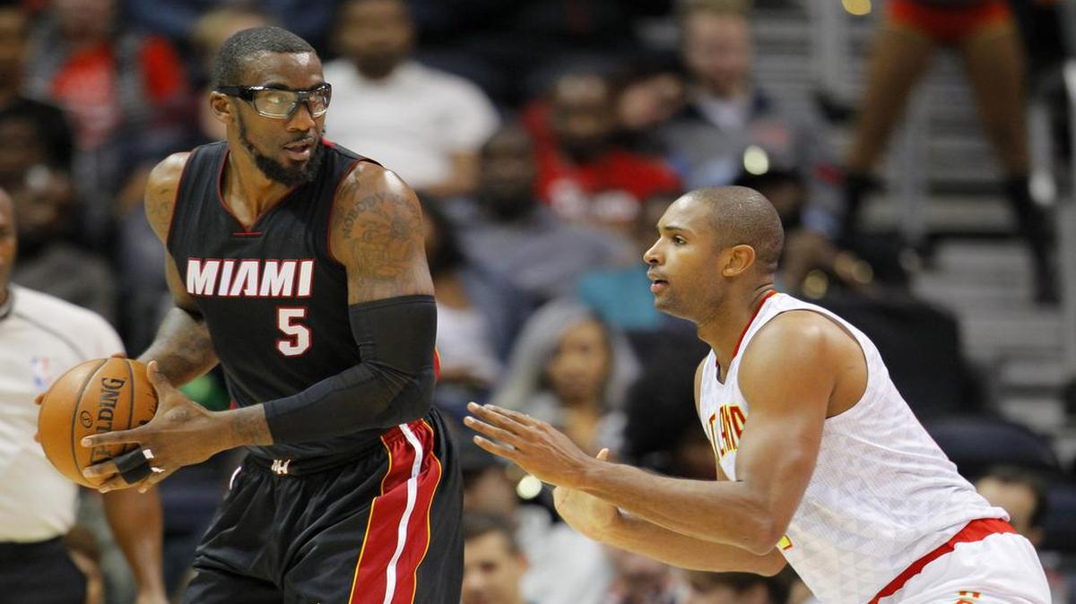 Miami Heat forward Amar'e Stoudemire (5) is defended by Atlanta Hawks forward Al Horford (15) in the first half of a preseason NBA basketball game on Sunday, Oct. 18, 2015, in Atlanta.