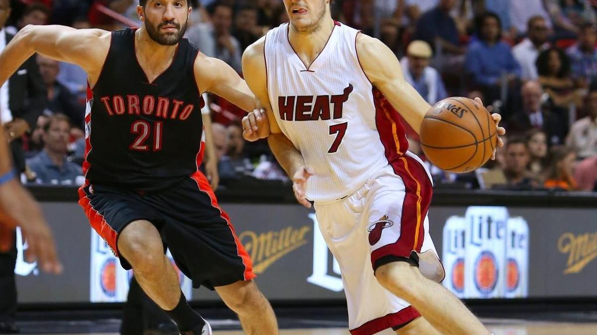 Miami Heat guard Goran Dragic drives against Toronto Raptors guard Greivis Vasquez at AmericanAirlines Arena in Miami on Saturday, April 11, 2015.