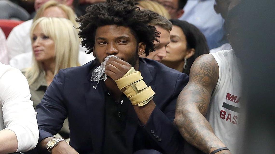 Miami Heat forward Justise Winslow watches the game from the bench during the second quarter of the Miami Heat’s game against the New York Knicks at AmericanAirlines Arena in Miami on Tuesday, December 6, 2016.