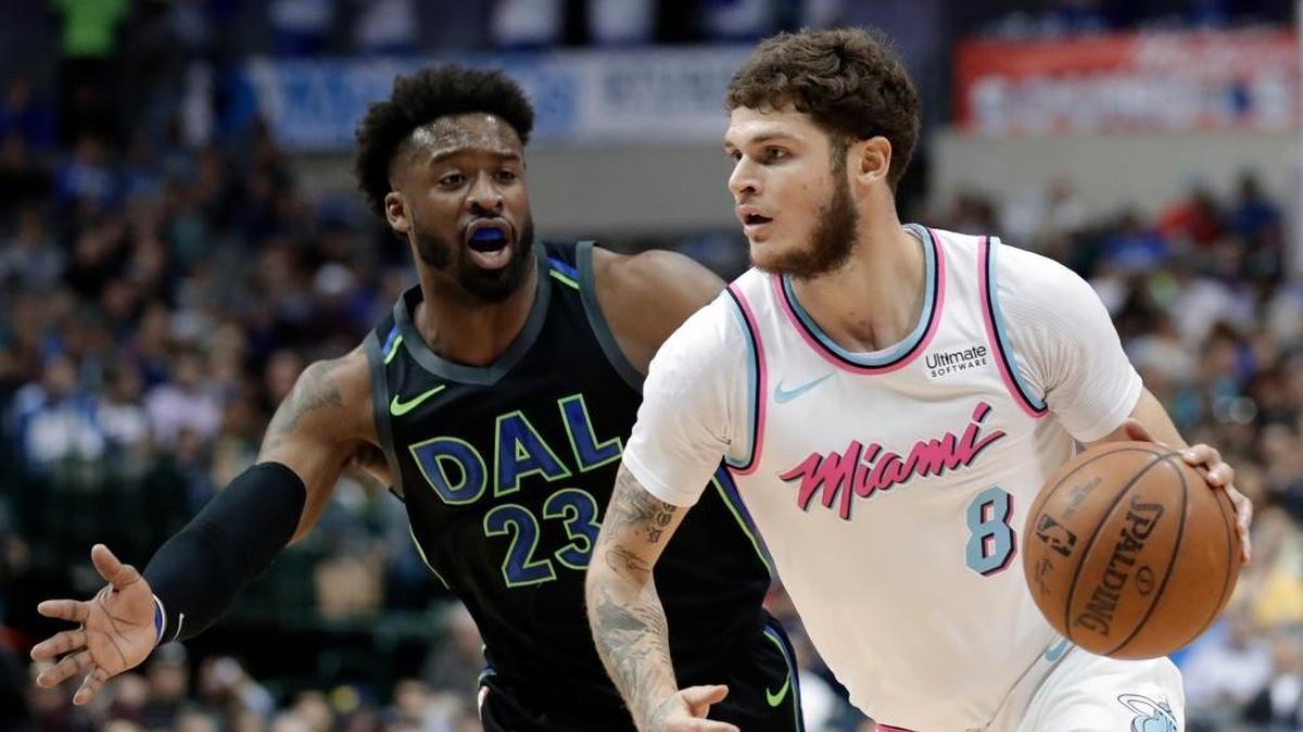 Dallas Mavericks guard Wesley Matthews (23) defends as Miami Heat guard Tyler Johnson (8) advances the ball upcourt in the first half of Monday’s game.