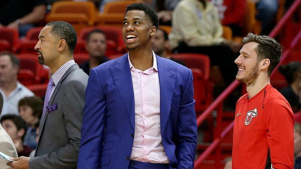 Heat point guard Goran Dragic, right, and center Hassan Whiteside, middle, react on the bench as the Heat lead the Dallas Mavericks in the fourth quarter of an NBA game at AmericanAirlines Arena in Miami on Friday, December 22, 2017.