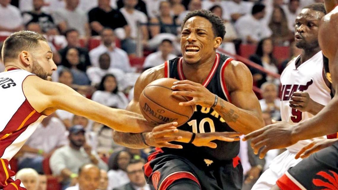 Miami Heat's Josh McRoberts, left, fouls Toronto Raptors' DeMar Rozan in the first quarter of Game 4 of the second round of the NBA Playoffs at the AmericanAirlines Arena in Miami, Florida, Mon., May 9, 2016.