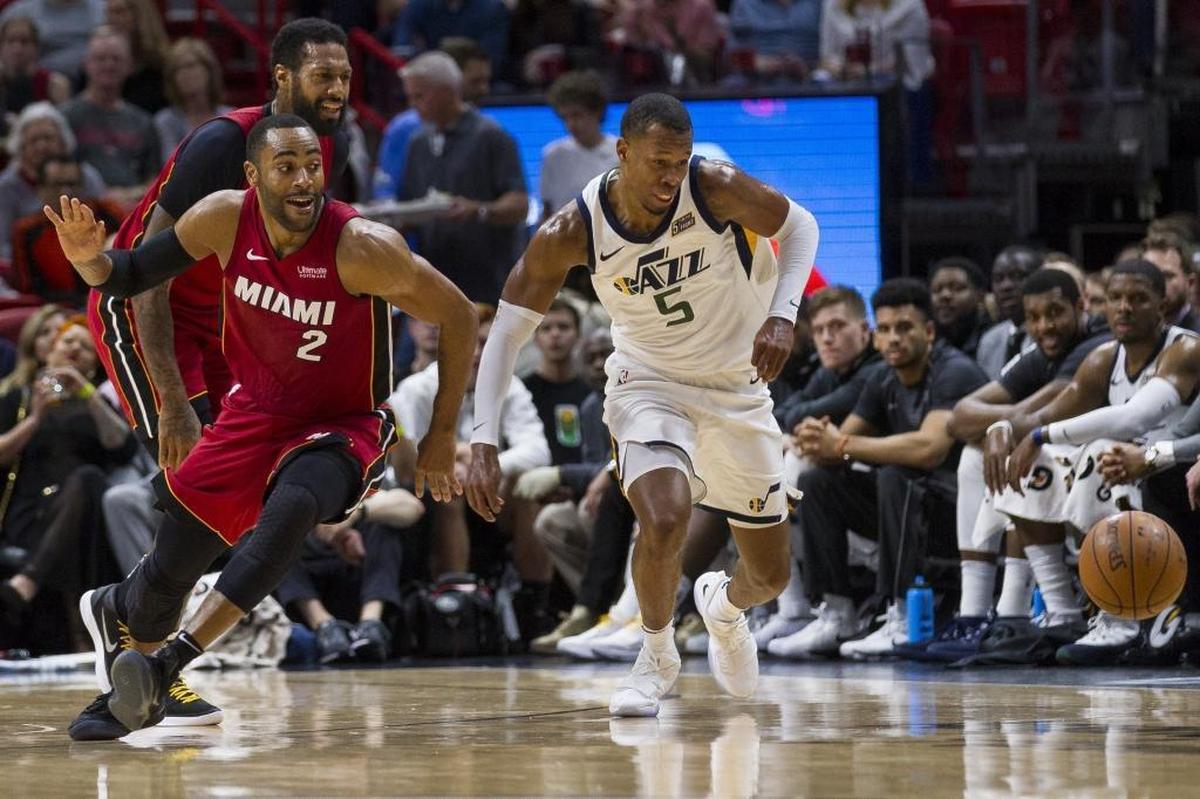Miami Heat guard Wayne Ellington (2) fights for possession of the ball against the Jazz’s Rodney Hood (5) in the second quarter as the Heat hosts the Utah Jazz at the AmericanAirlines Arena on Sunday, Jan. 7, 2018.