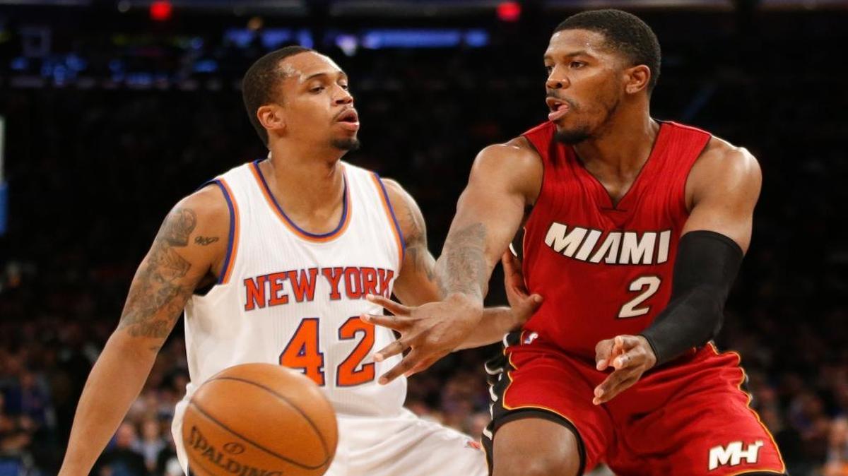 New York Knicks forward Lance Thomas (42) defends as Miami Heat forward Joe Johnson (2) passes in the first half of an NBA basketball game at Madison Square Garden in New York, Sunday, Feb. 28, 2016.