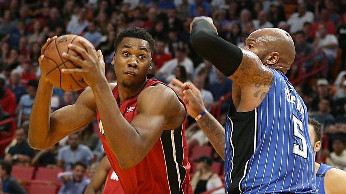 Miami Heat center Hassan Whiteside goes to the basket against Magic forward Marreese Speights in the second quarter of the Heat’s win over Orlando at AmericanAirlines Arena in Miami on Tuesday, December 26, 2017.