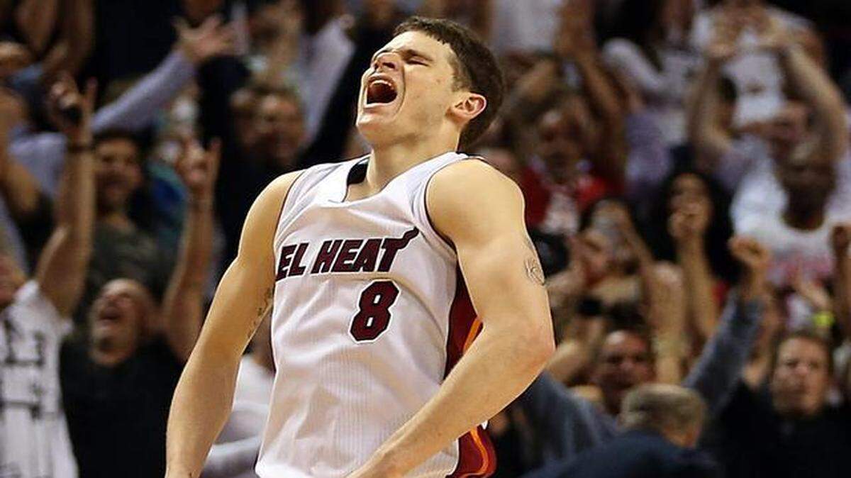 
Miami Heat guard Tyler Johnson reacts after shooting a 3-pointer against the Sacramento Kings for a Heat lead during overtime of their game at AmericanAirlines Arena in Miami on March 07, 2015.
