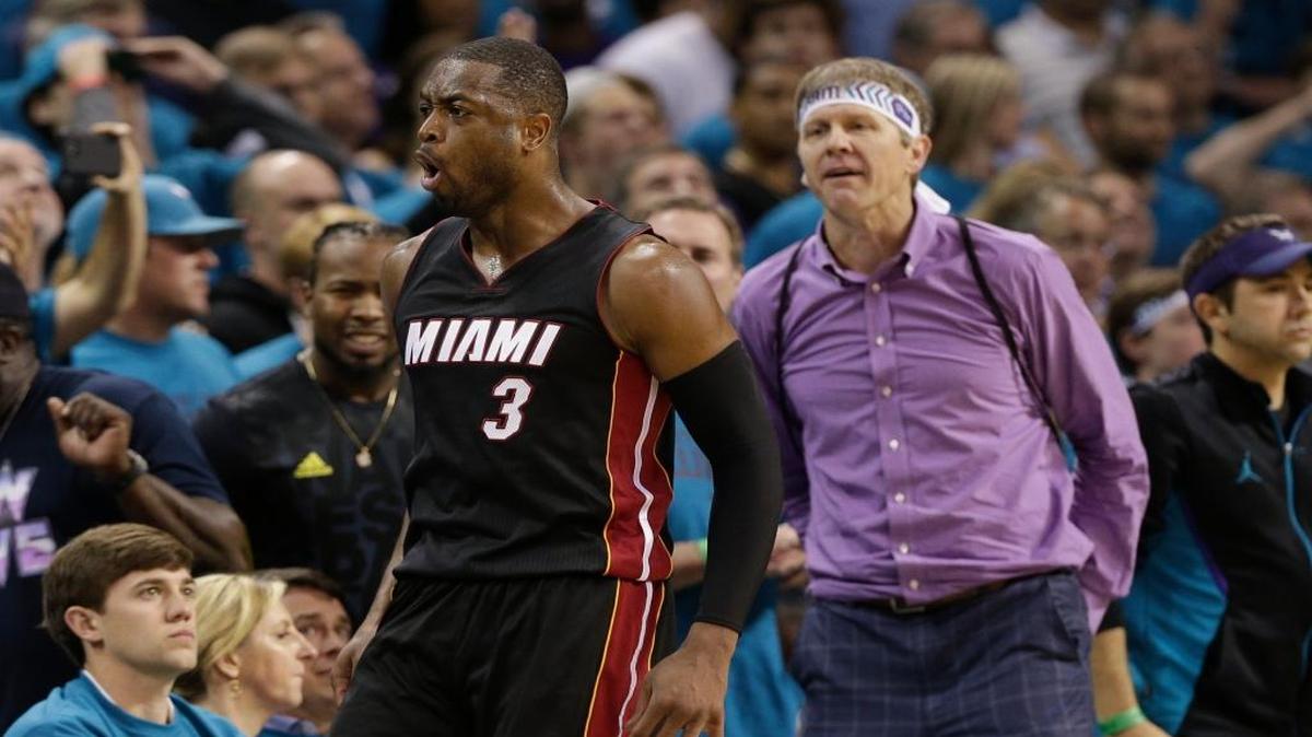 Miami Heat's Dwyane Wade (3) reacts after making a 3-point basket against the Charlotte Hornets during the second half in Game 6 of an NBA basketball playoffs first-round series in Charlotte, N.C., Friday, April 29, 2016. The Heat won 97-90.