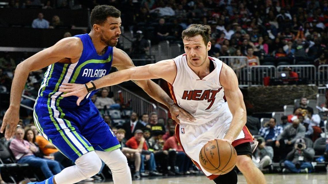 Miami Heat guard Goran Dragic (7) drives the lane as Atlanta Hawks forward Thabo Sefolosha defends during an NBA basketball game, Friday, Feb. 24, 2017, in Atlanta.