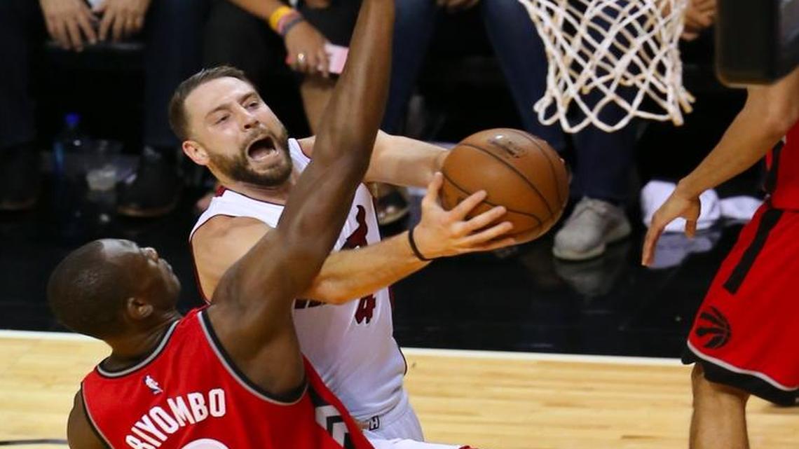 Miami Heat forward Josh McRoberts goes to the basket against Toronto Raptors center Bismack Biyombo during the fourth quarter of Game 6 of the NBA Eastern Conference semifinal series at AmericanAirlines Arena in Miami on Fri., May 13, 2016.