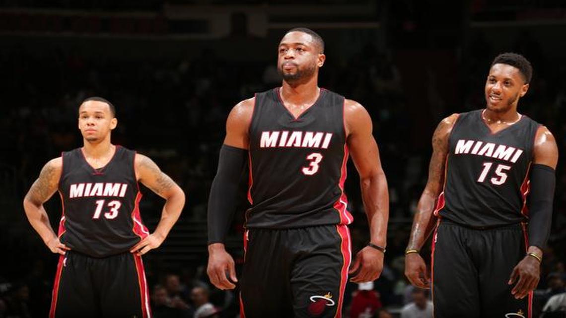 
 Shabazz Napier #13, Dwyane Wade #3 and Mario Chalmers #15 of the Miami Heat during the game against the Washington Wizards on December 1, 2014 at Verizon Center in Washington, DC. 
