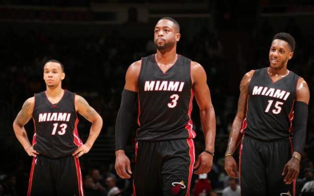 
 Shabazz Napier #13, Dwyane Wade #3 and Mario Chalmers #15 of the Miami Heat during the game against the Washington Wizards on December 1, 2014 at Verizon Center in Washington, DC. 
